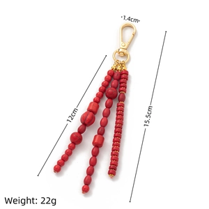 Detail view of Bohemian red beaded tassel keychain with dimensions and weight specs