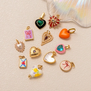 Collection of 12 gold-plated zircon heart and envelope charms with enamel and pearls