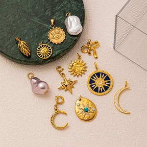 Selection of 18k gold plated stainless steel charms with sun moon stars and pearl details