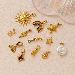 Detailed set of 12 gold plated celestial charms including stars moon and baroque pearl
