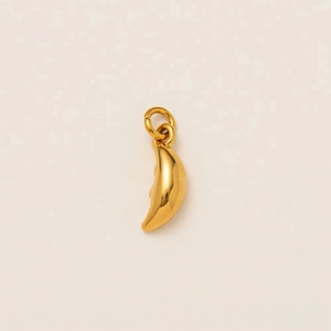 Polished gold crescent moon pendant with detailed face profile carving on white background