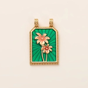 Macro shot of rectangular green enamel tarot pendant with gold floral engravings