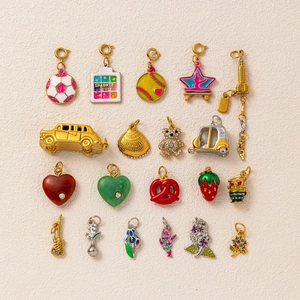 Detailed view of 20 assorted colorful enamel and 18K gold plated charms for DIY jewelry