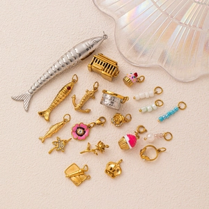 Mix of 18K gold plated fish and nautical charms with colorful enamel and crystal accents