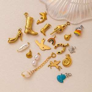 Selection of 18K gold plated stainless steel charms including boots and shells for DIY jewelry