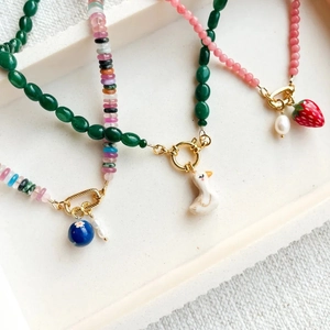 Nordic style handmade beaded charms with ceramic duck, strawberry and floral pendants