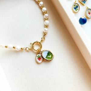 Nordic style pearl necklace with gold clasp and strawberry duck pendant charms