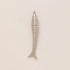 Detailed macro view of silver fish pendant with textured scales and closed loop connector