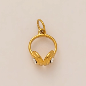 Detailed view of 18K gold plated headphone charm with sparkling cubic zirconia crystals