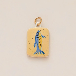 Artistic rectangular fish charm with hand-painted enamel pattern and gold link loop