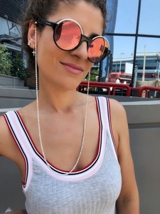 Silver bead sunglasses chain on model with vintage oversized sunglasses in street style
