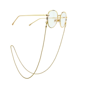 Minimalist gold round frame glasses with matching beaded chain strap on white background