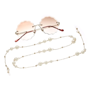 Elegant gold pearl glasses chain with rimless scallop-edge round sunglasses in gradient brown