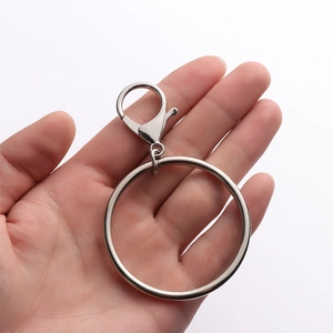 Polished silver metal keychain with large round ring and lobster clasp for jeans