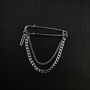 Silver punk safety pin brooch with layered metal chains for streetwear and hip-hop style