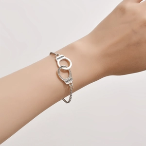 Chic silver-colored handcuff bracelet with Freedom engraving for a trendy hip-hop style look