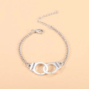 Silver handcuffs pendant necklace featuring engraved Freedom text on O-chain with lobster clasp