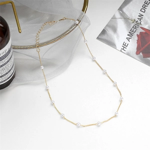 Elegant gold pearl necklace for women with white round pearls and lobster clasp