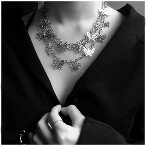 Three-layer silver metal butterfly chain necklace featuring hollow pendants in retro style