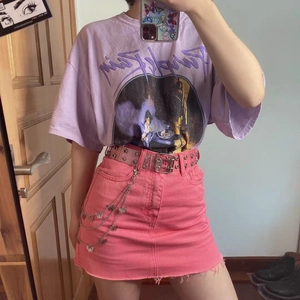Three-layer butterfly metal waist chain styled on pink denim skirt for a trendy look