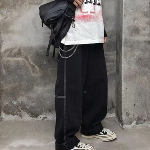Black wide-leg cargo pants with white contrast stitching and silver metal chains