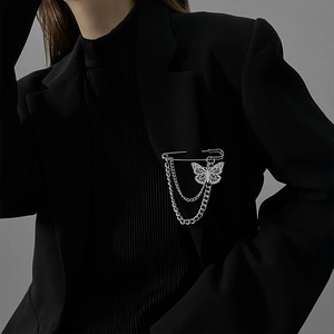 Silver double chain butterfly brooch pin accessory for suit on black outfit