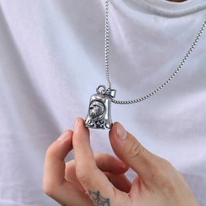 Retro stainless steel eagle bell pendant necklace with box chain for men on a white tee