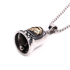Detailed view of vintage steel eagle bell pendant with golden lion relief and engravings