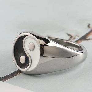 Polished stainless steel signet ring featuring a black and white Tai Chi Yin Yang design