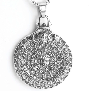 Macro detail of Buddhist amulet pendant with intricate Nine Palace Bagua engravings