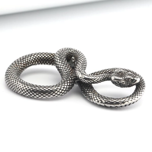 Retro silver cobra pendant with detailed scale texture and punk rock style design