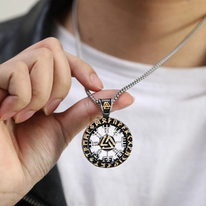 Detail of Viking Valknut pendant with gold two-tone finish and runic engravings