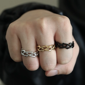 Minimalist irregular criss-cross thorn rings in silver, gold, and black stainless steel