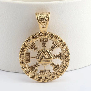 Macro view of gold stainless steel Viking Valknut pendant with embossed runes