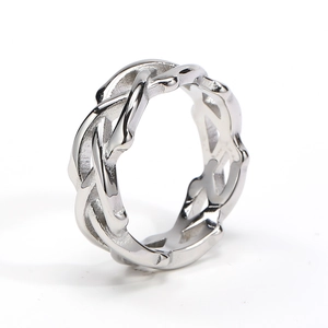 Detailed view of silver stainless steel ring with a trendy interlaced hollow weave design