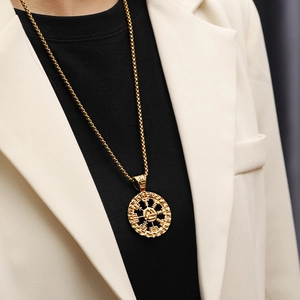 Golden Viking Valknut pendant necklace shown on a model with a square box chain detail