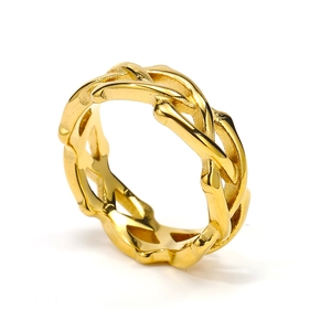 Macro view of gold-plated stainless steel ring with intricate woven crisscross texture