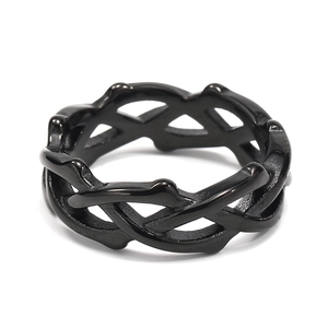 Detailed view of the black stainless steel ring featuring a unique woven thorn design