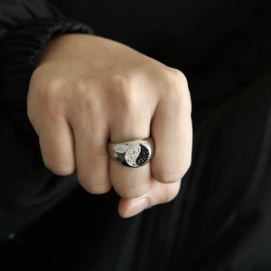 Detailed view of punk style Yin Yang ring with inlaid crystals on a silver stainless steel band