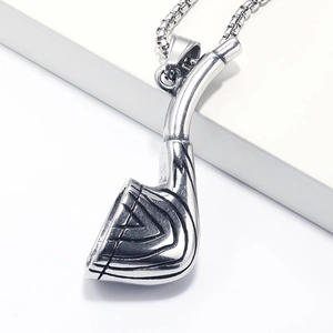 Macro detail of vintage golf club head pendant with aged stainless steel texture