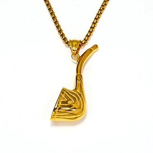 Macro detail of golden golf club pendant and square box chain necklace for men