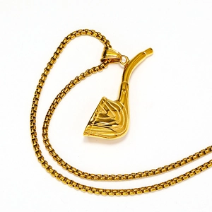 Macro detail of gold-plated golf club pendant and polished box chain necklace