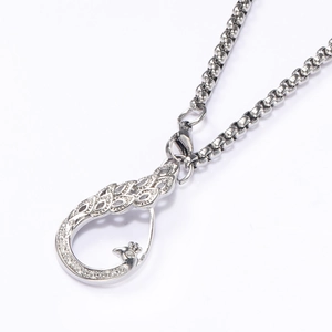 Silver-toned peacock pendant necklace in hollow teardrop design with sparkling rhinestones