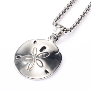 Detailed close-up of polished silver floral engraved round pendant and box chain