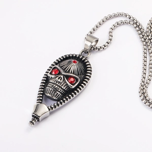 Vintage punk skull pendant with red stones in zipper frame on silver box chain