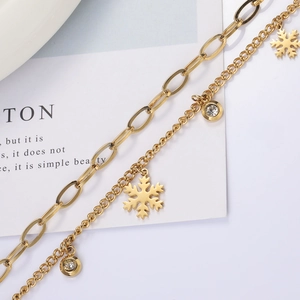 Gouden dubbellaagse sneeuwvlok armband met zirkonia bedeltjes en paperclip schakelketting