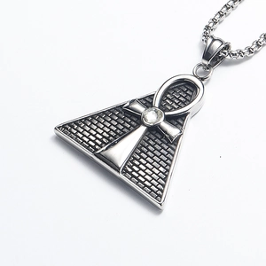Close-up of Eye of Horus pyramid pendant with Ankh symbol and inset zircon stone