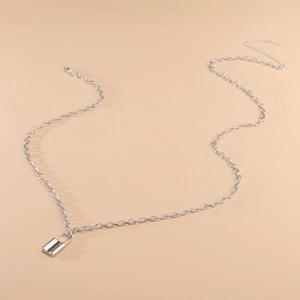 Close-up of silver punk padlock pendant on adjustable titanium steel waist chain belt