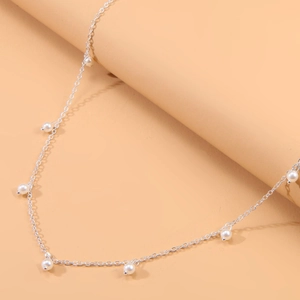 Chaîne de taille argentée minimaliste avec glands en perles pour bijoux de bikini