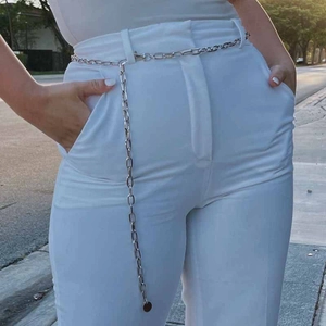 Fashion silver alloy chain waist belt with round pendant on white pants for women